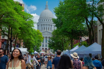 Residents gather on State Street for Art Fair. 